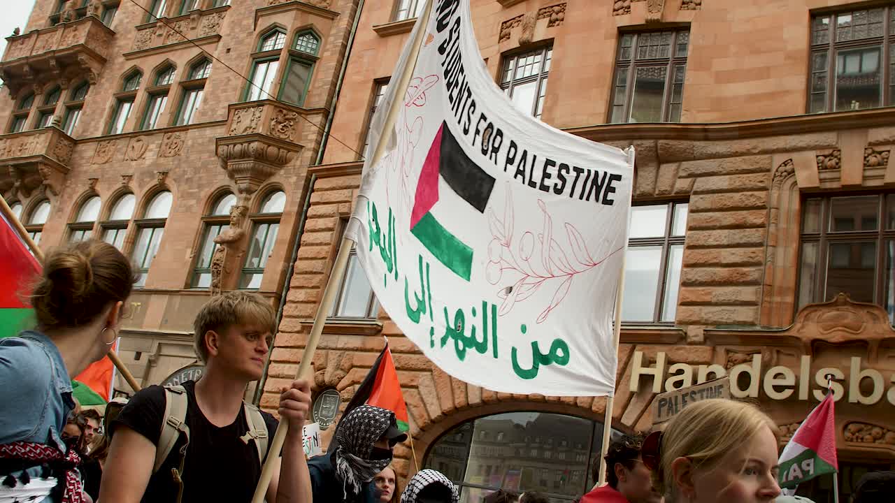 Pro Palestine protesters march against Israel’s Eurovision participation in Malmö (Sweden), calling for a ceasefire on the war in Gaza, Eurovision song contest 2024, medium handheld shot