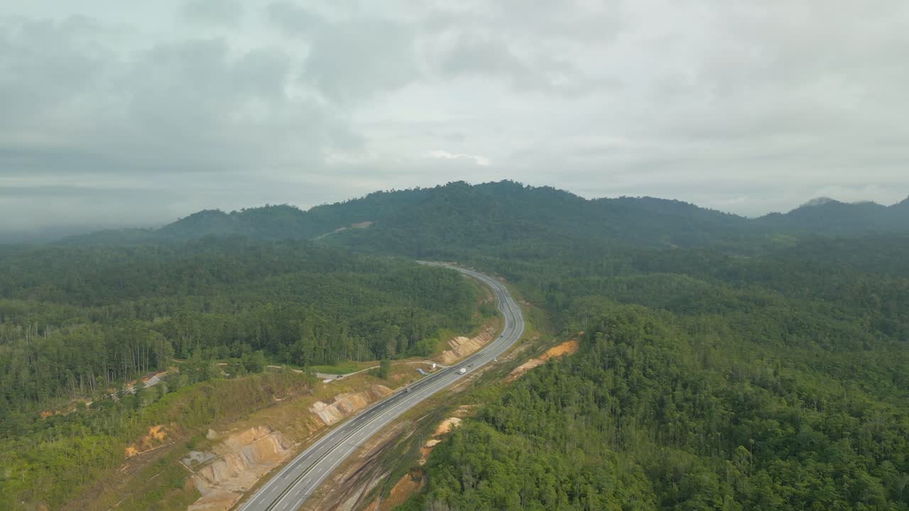 Beautiful Drone View Of Bau To Lundu Pan Borneo Highway During Morning Sunset With Mountain And Valley, Green Forest,Sarawak, Borneo.