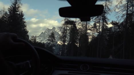 Slow-motion-footage-through-the-car-side-window-while-driving-in-the-Swiss-Alps