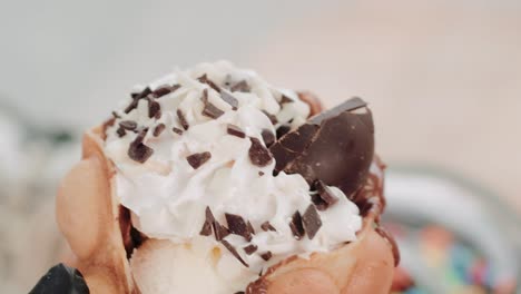 decorating a tasty chocolate waffle with more chocolates