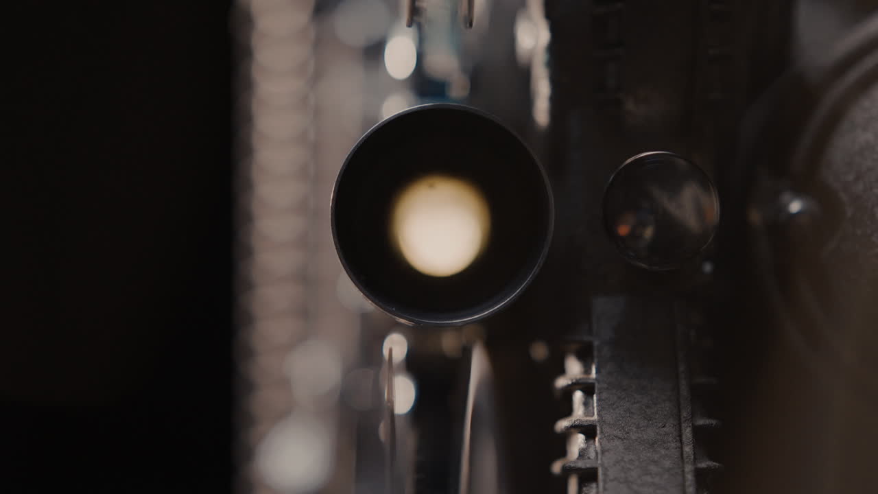 Close-up of an old film projector lens