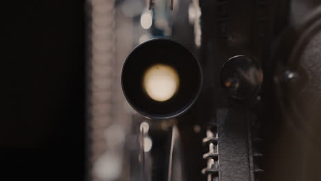 close-up of an old film projector lens