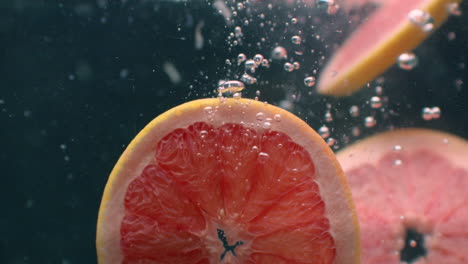 grapefruit under water with air bubbles and in slow motion. fresh and juicy healthy vegetarian