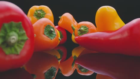 colorful fresh peppers on mirrored table