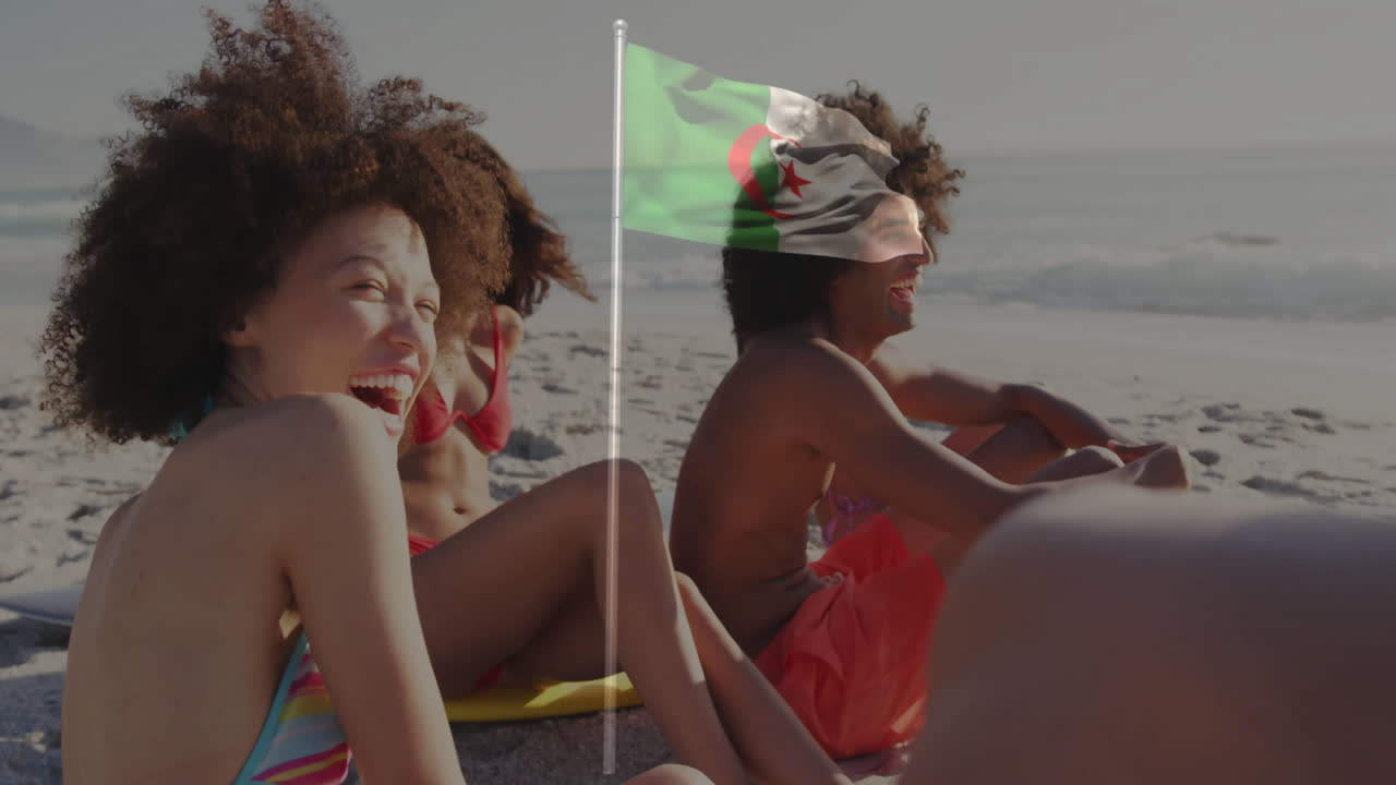 Waving Algerian flag, friends relaxing on beach enjoying animation in background