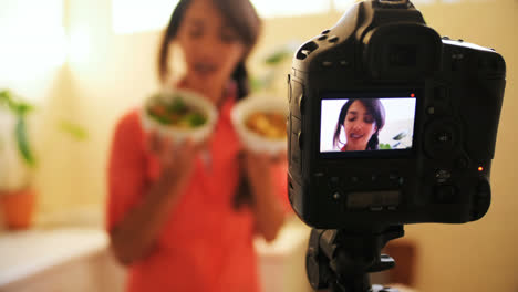 female video blogger recording video food vlog 4k