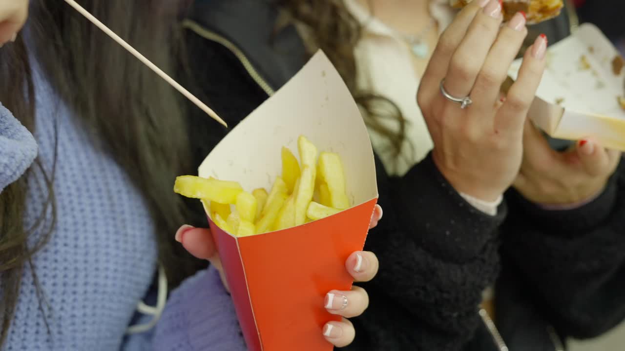 Friends Enjoying Fries and Other Snacks
