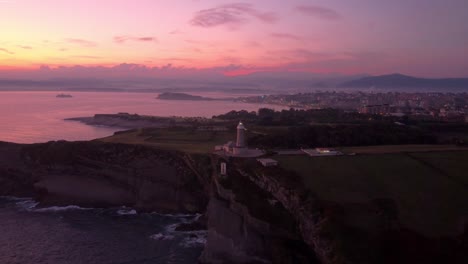 santander spain aerial view of the city during epic sunset, drone fly over lighthouse