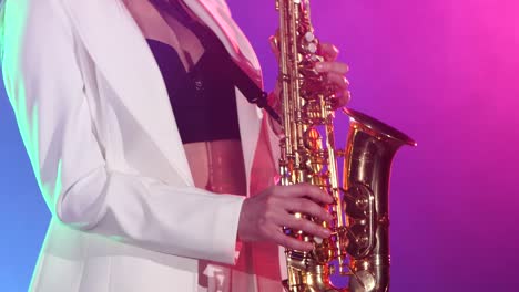 Woman Playing Saxophone on Stage