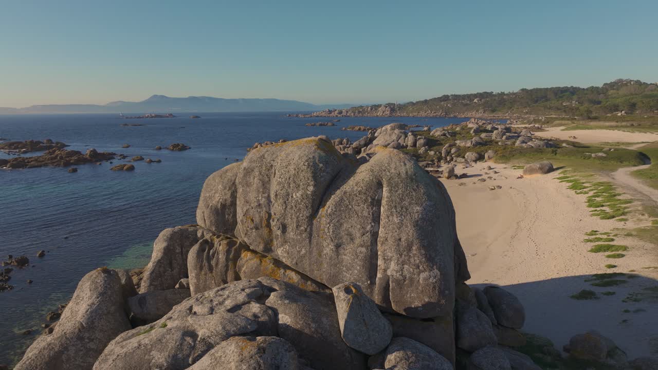 Massive Rock Formations At Con Negro Beach In San Vicente do Mar, O Grove In Galicia, Pontevedra, Spain. Aerial Drone Shot