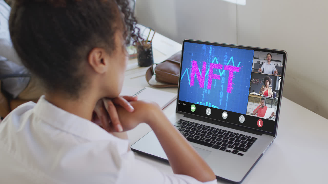 Video of biracial woman having nft video call with coworkers