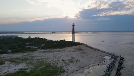 a 4k drone shot of the barnegat lighthouse, located on the northern tip of long beach island in ocean county, new jersey, u