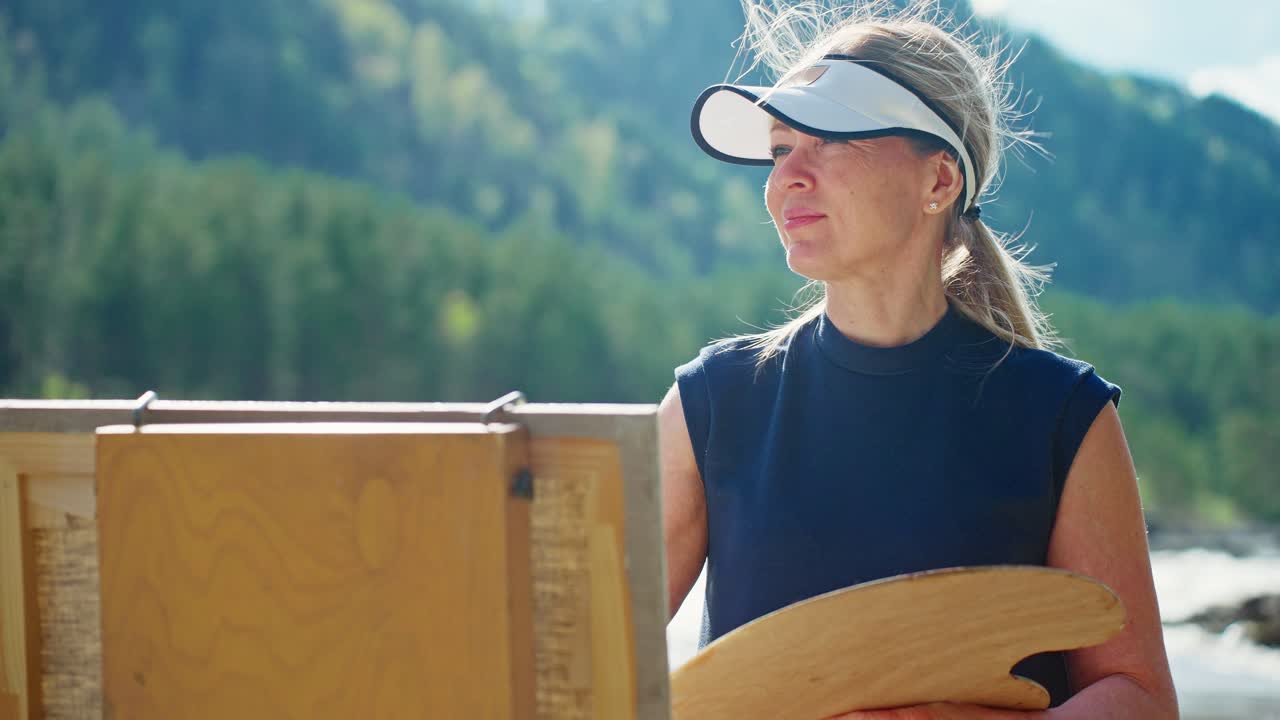 Woman Painter in Mountains