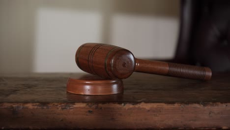 old wooden gavel on historic mid 1800's judges bench