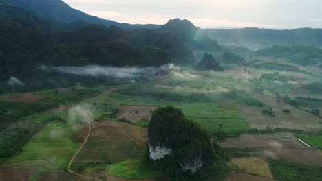 aerial view of peaceful rural village surrounded by mountain