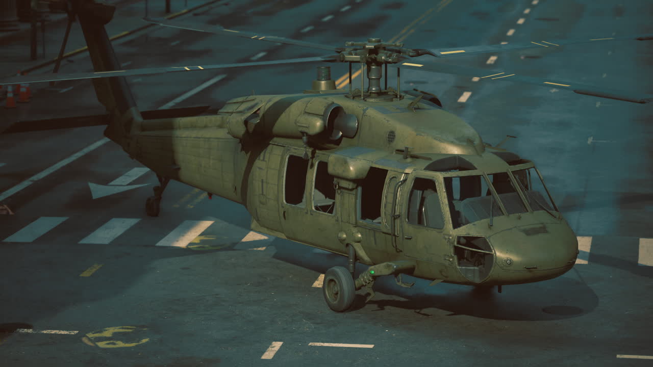 Military helicopter perched on an empty city street during twilight hours