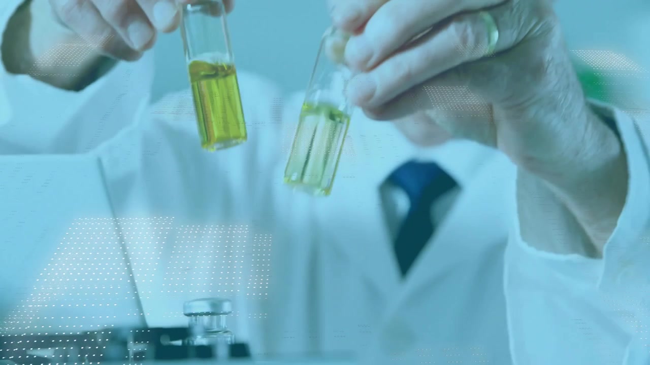 Senior scientist reaching for test tube inserting yellow solution into analyzer for color analysis