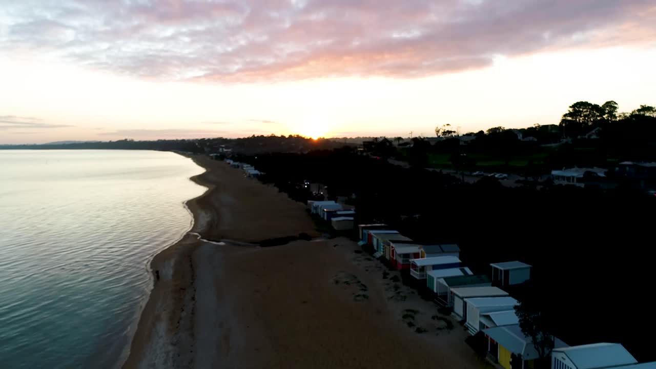 Colorful Beach Huts at Sunrise
