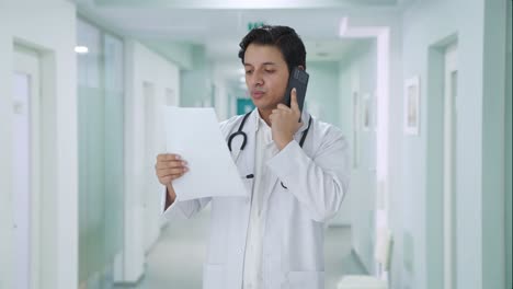 Sad-Indian-doctor-explaining-medical-report-on-call