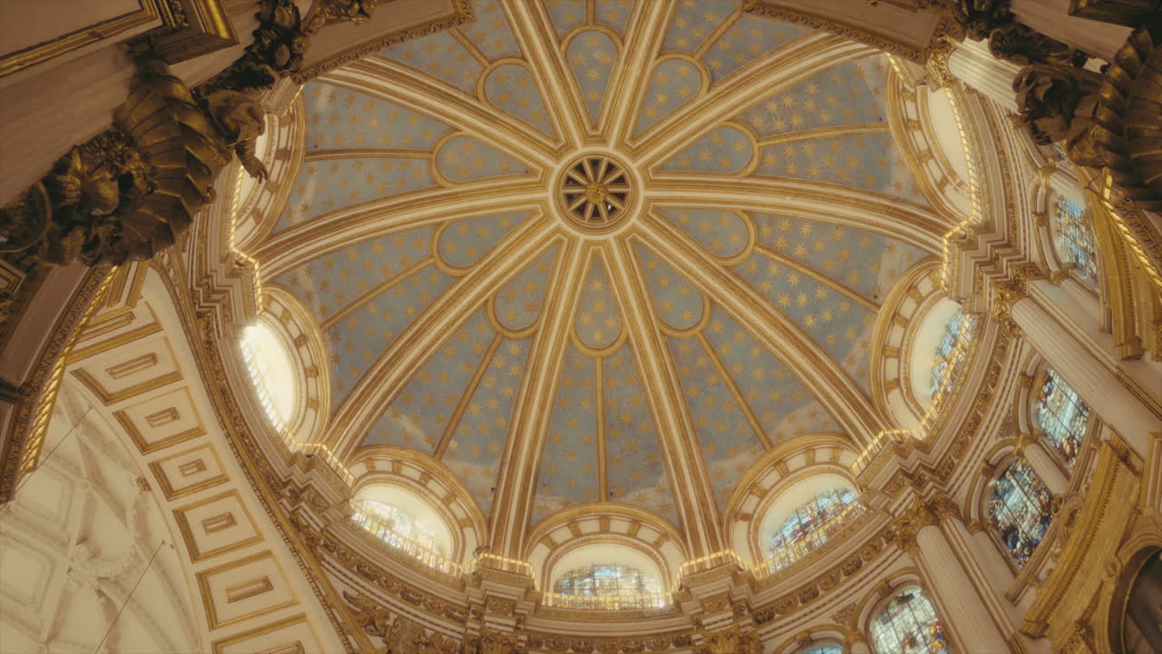 Ceiling of a cathedral with sunlight shining in, Granada, Spain