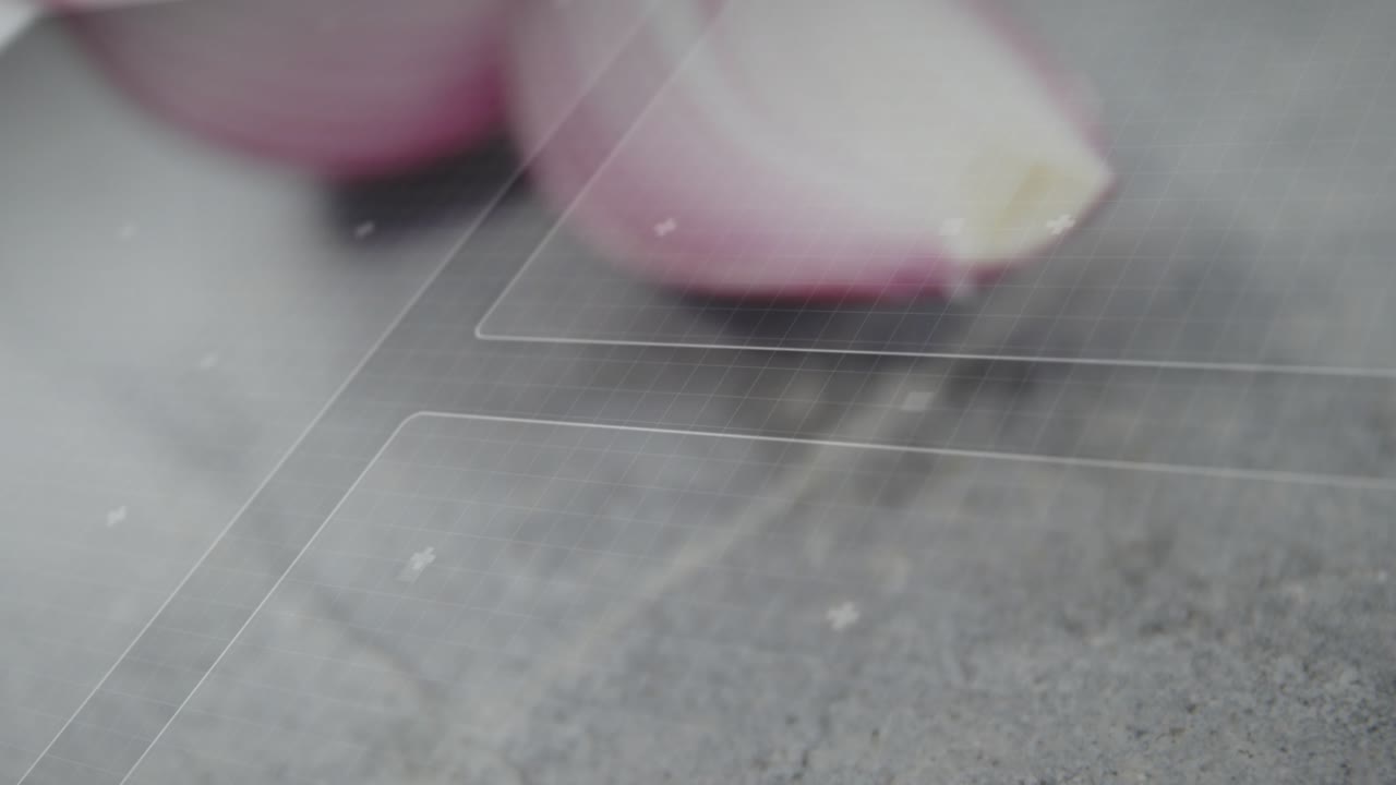 Camera pulling back and focus sharpening, revealing two halved red onions to highlight layer detail