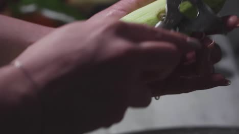 women's hands wash, peel and cut vegetables into vegetable stew