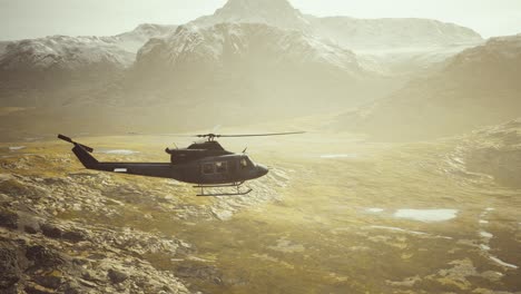 slow motion vietnam war era helicopter in mountains