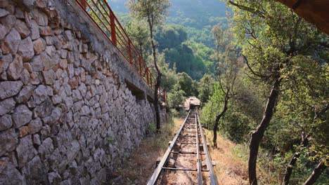 lebanese funicular train moving outwards tunnel at zahlan grotto in syr el danniyeh, lebanon