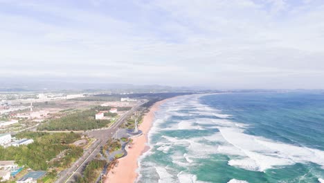 aerial view dolly of the beach and the city in tuy hoa.