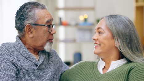 Conversation,-smile-and-senior-couple-on-sofa