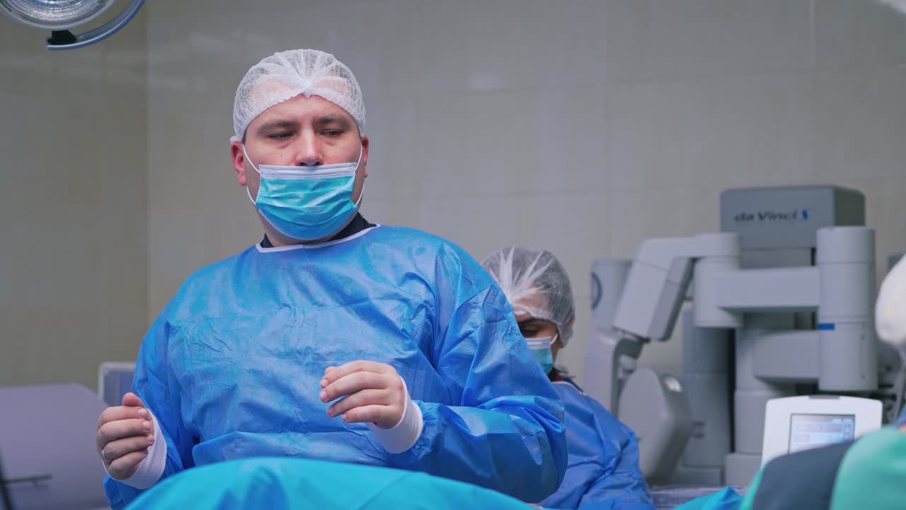 Doctor in operating theater. Portrait of doctor during surgery at hospital