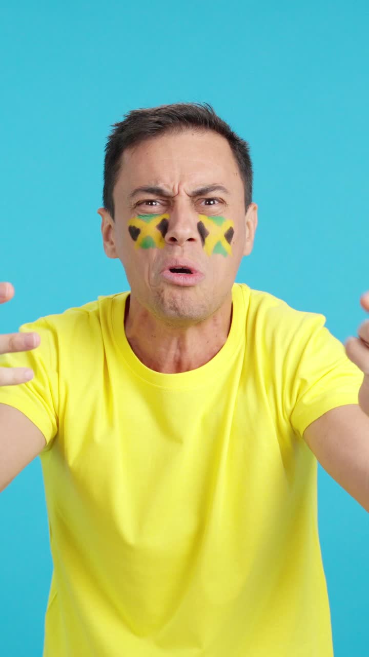 Man Cheering for Jamaica, angry with the decision of referee