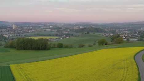 Aerial-drone-view-of-Berne,-Ostermundigen,-Wankdorf,-Switzerland-with-Alps-in-background