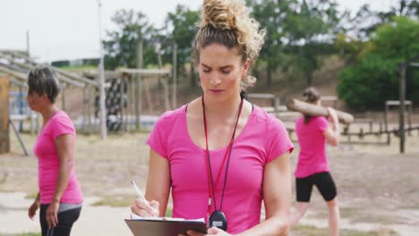 female coach standing at bootcamp