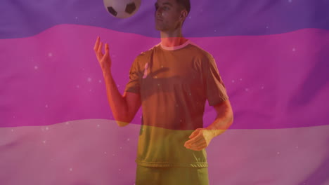 animation of flag of germany over caucasian male football player with ball