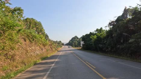 a vehicle's journey along a tranquil rural road