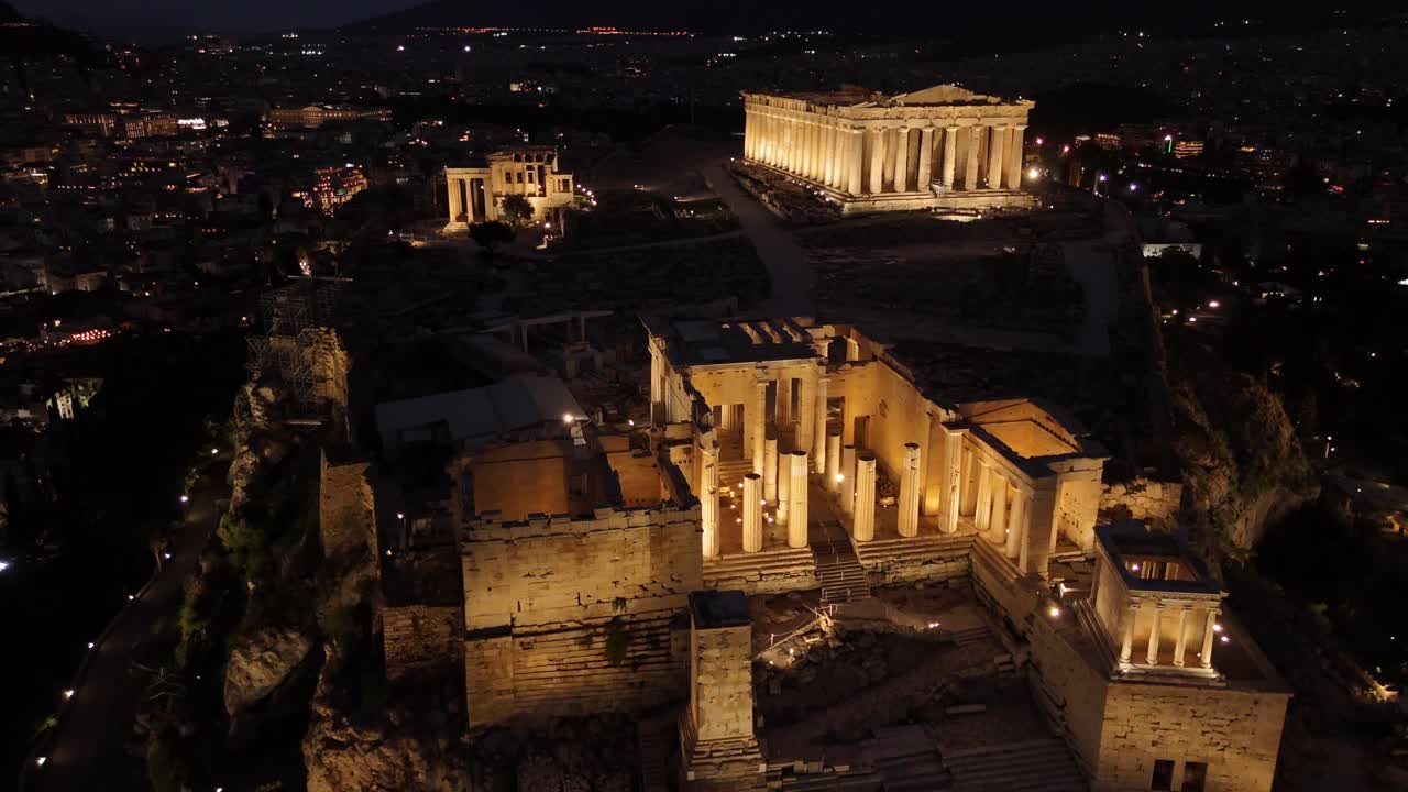 Athens,Beautifully illuminated Acropolis's Aerial view backwards at night from Panthenon towards entrance. Full view of Panthenon and Erechthenion in shimmering lights