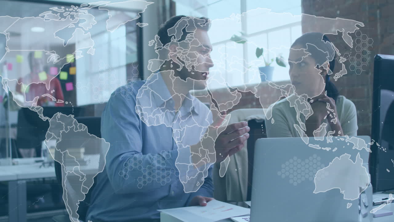 Animation of data processing and world map over diverse man and woman discussing at office