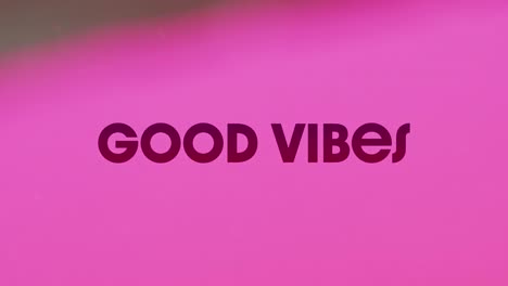 Animation-of-good-vibes-text-over-abstract-liquid-pink-background