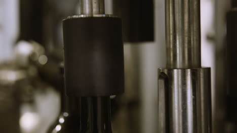 wine bottles on conveyor belt in wine factory