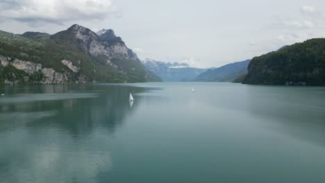 calm waters of switzerland lake with yachts sailing creating tranquil scene