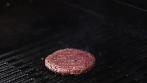 time-lapse of a burger patty cooking on a grill