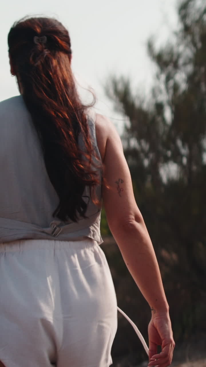 Woman walking outdoors in stylish outfit