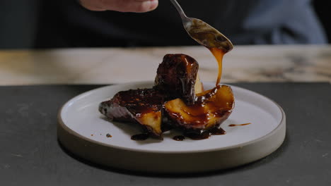 slow motion shot of a chef plating a gourmet sweet potato dish in a restaurant