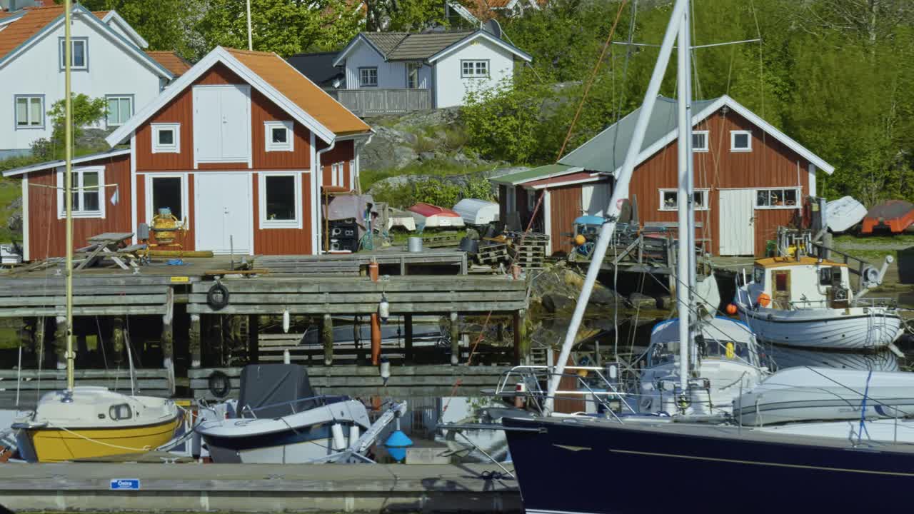 Idyllic view of Swedish archipelago with colorful houses, boats, and piers