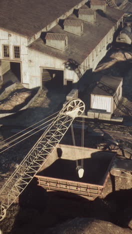 mining site with an excavator and buildings