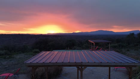 Colorful-sunset-at-Chateau-Aurou-pool,-aerial-view-of-town,-excellent-for-unforgettable-events