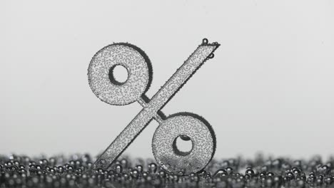 percentage sign underwater in bubbles of oxygen on blue background percentage sign underwater in bubbles of oxygen on blue background
