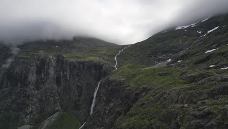 a cascading waterfall amidst the norwegian wilderness, aerial view