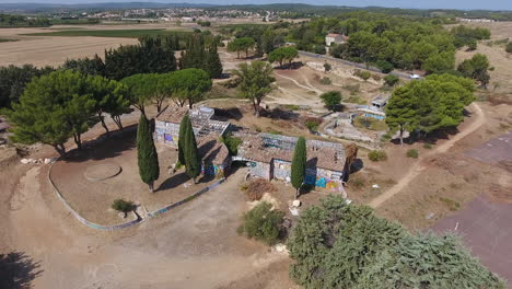 flying around an abandoned mansion with broken tiles aerial view. ruin disaster